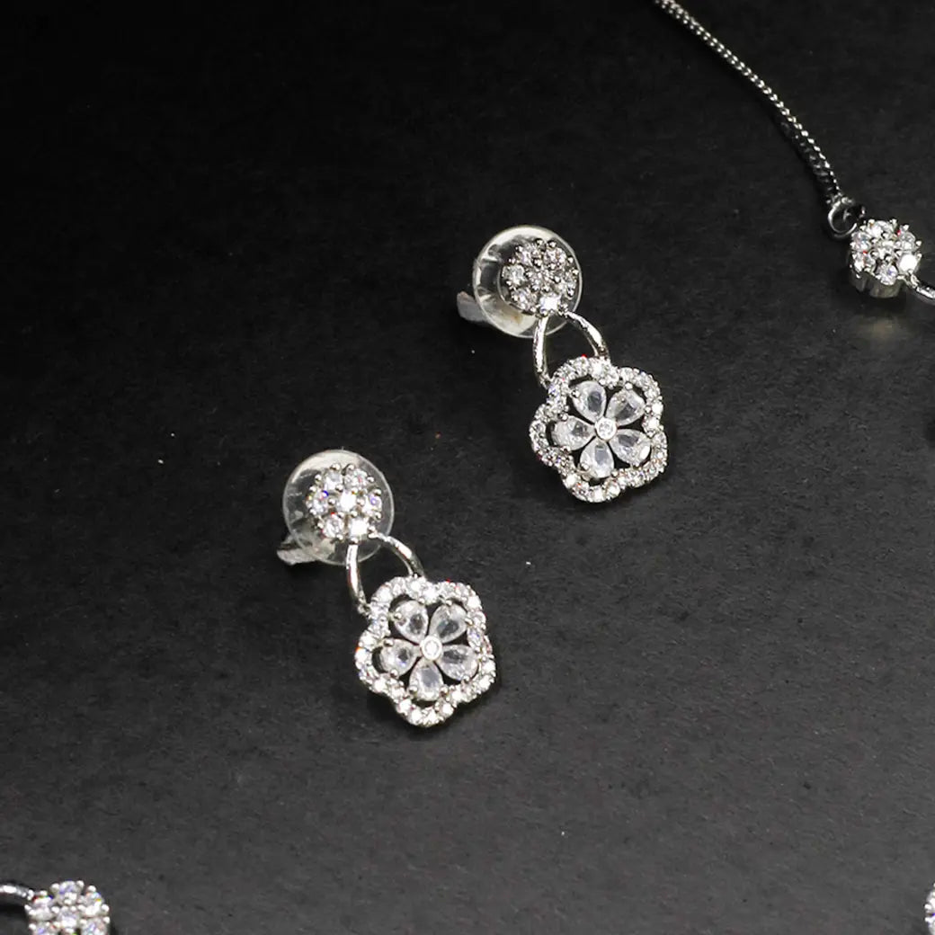 White stone necklace with matching earrings