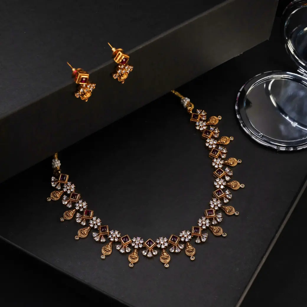 Antique necklace with white and ruby like stones