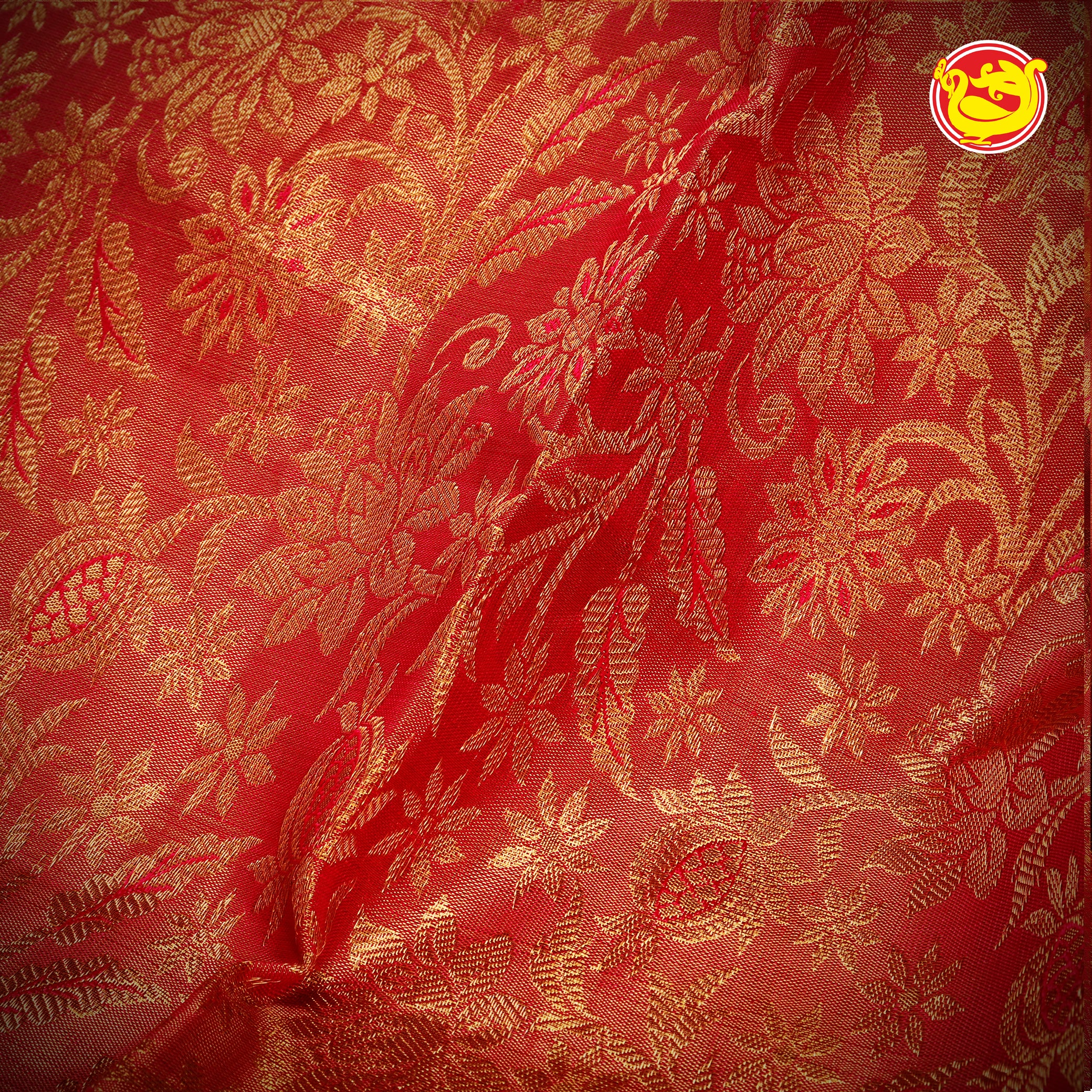 Red wedding silk saree with floral motifs weaving