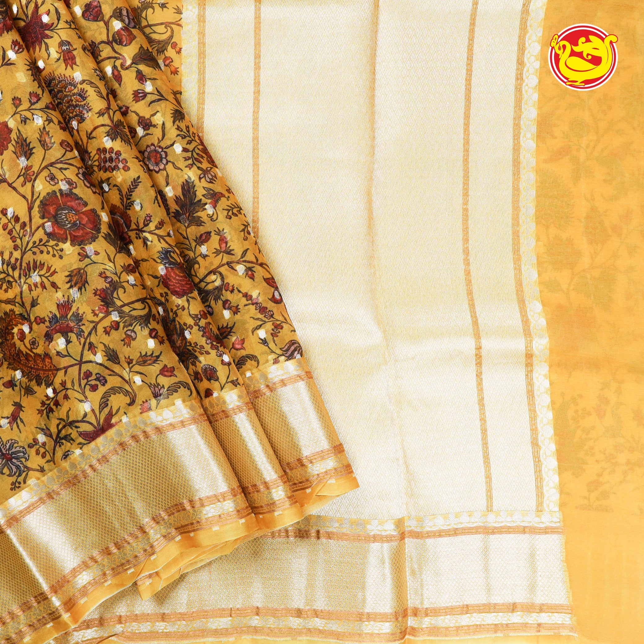 Yellow organza silk saree with floral embroidery and zari butta