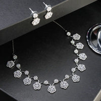 White stone necklace with matching earrings