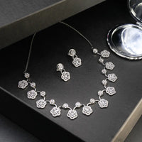 White stone necklace with matching earrings