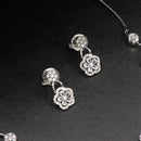 White stone necklace with matching earrings