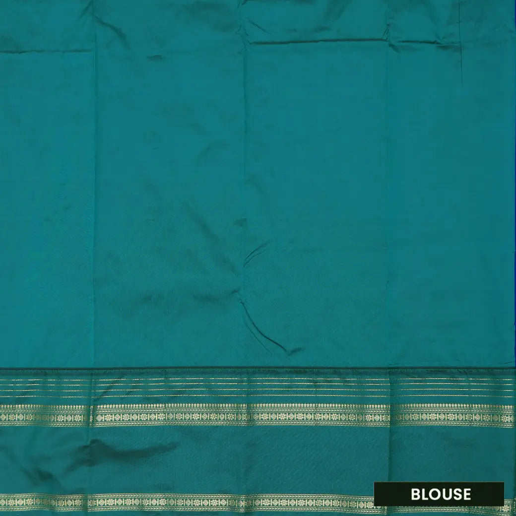 Royal Blue and Green, with accents of gold zari work. soft silk