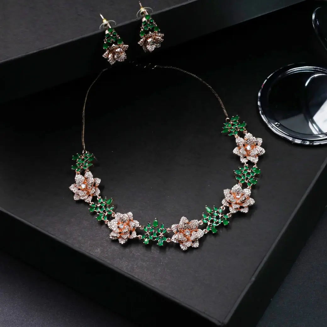 3D floral necklace with green stones and matching earrings