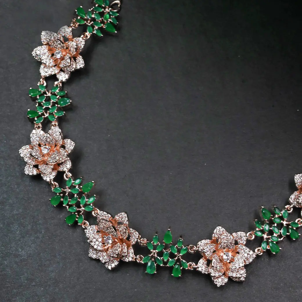 3D floral necklace with green stones and matching earrings