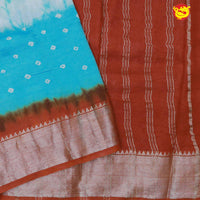 Turquoise blue with rust orange chanderi saree with tie and dye prints