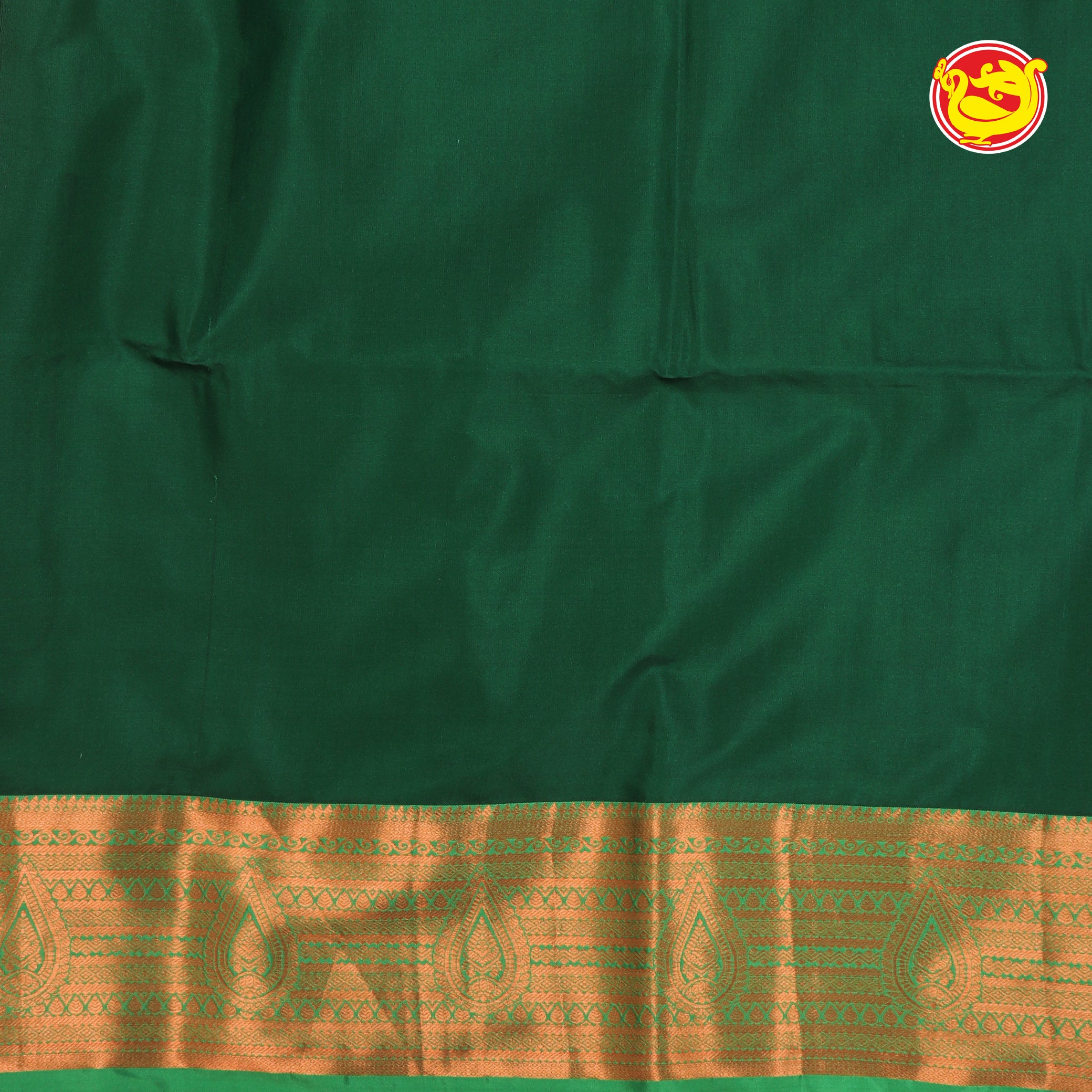 Magenta with bottle green soft silk saree with chakram motifs