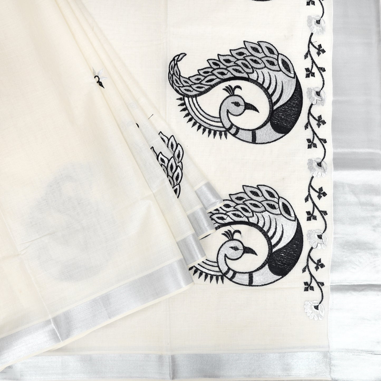 Off White With Silver Zeri Peacock Design traditional kerala onam saree