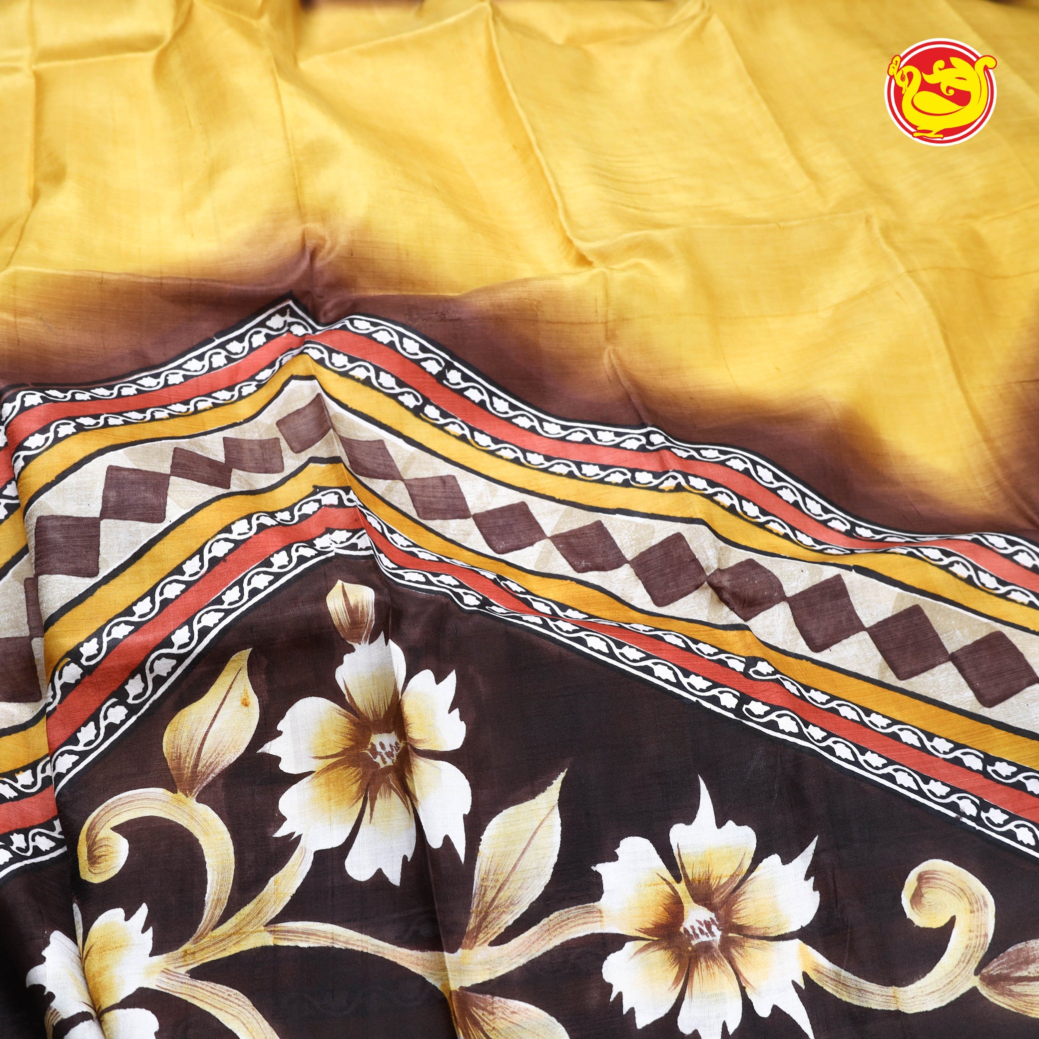 Yellow with brown printed tussar silk saree