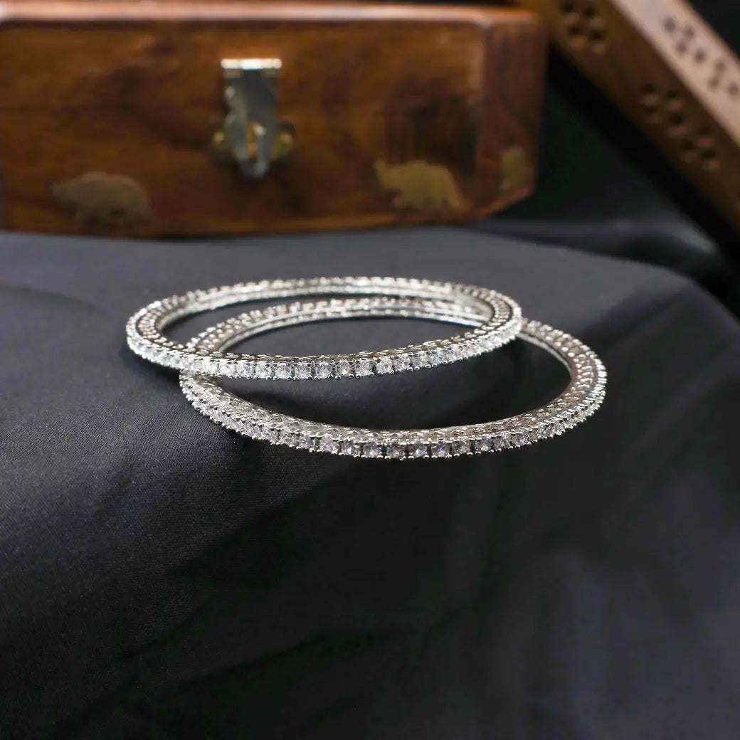 White stone bangles in rhodium like finish