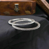 White stone bangles in rhodium like finish