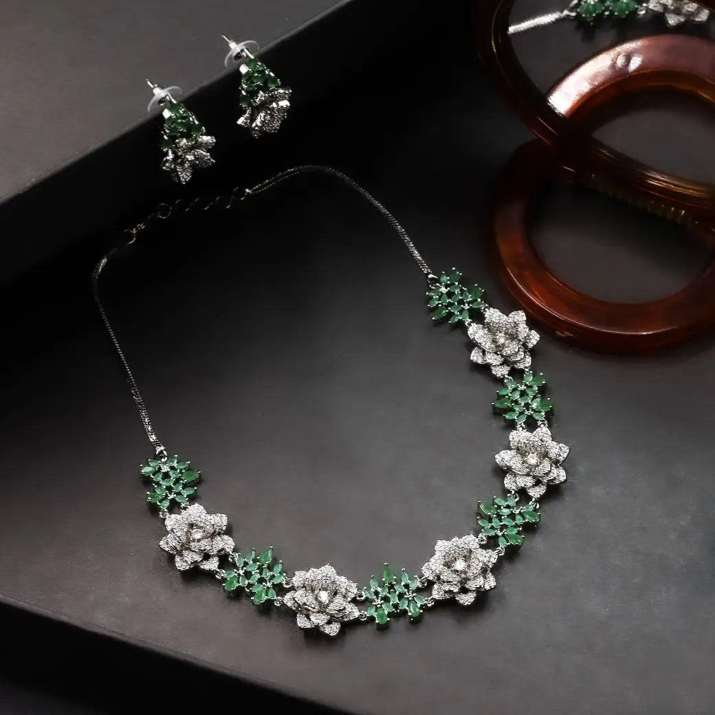 3D floral necklace with green stones and matching jhumkas