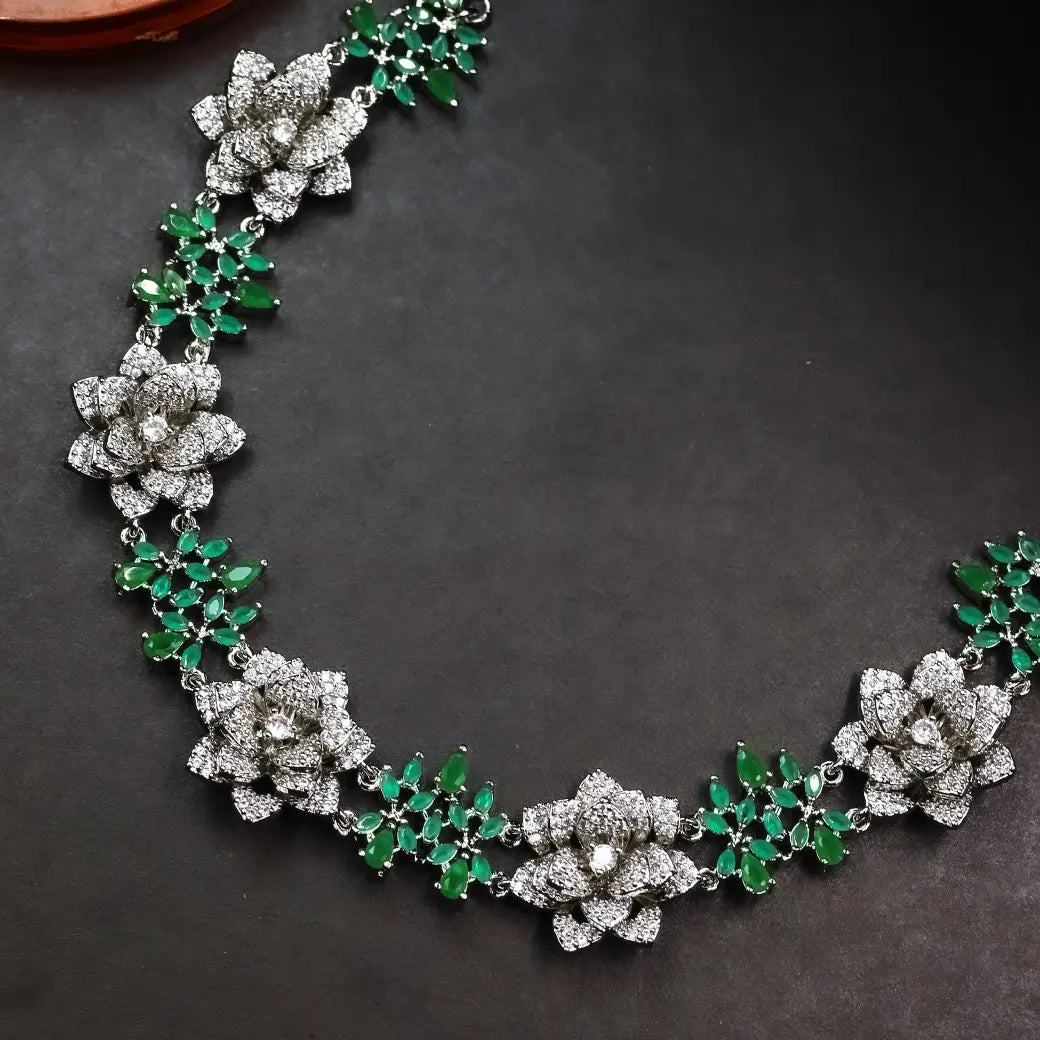 3D floral necklace with green stones and matching jhumkas