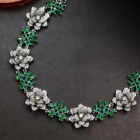 3D floral necklace with green stones and matching jhumkas