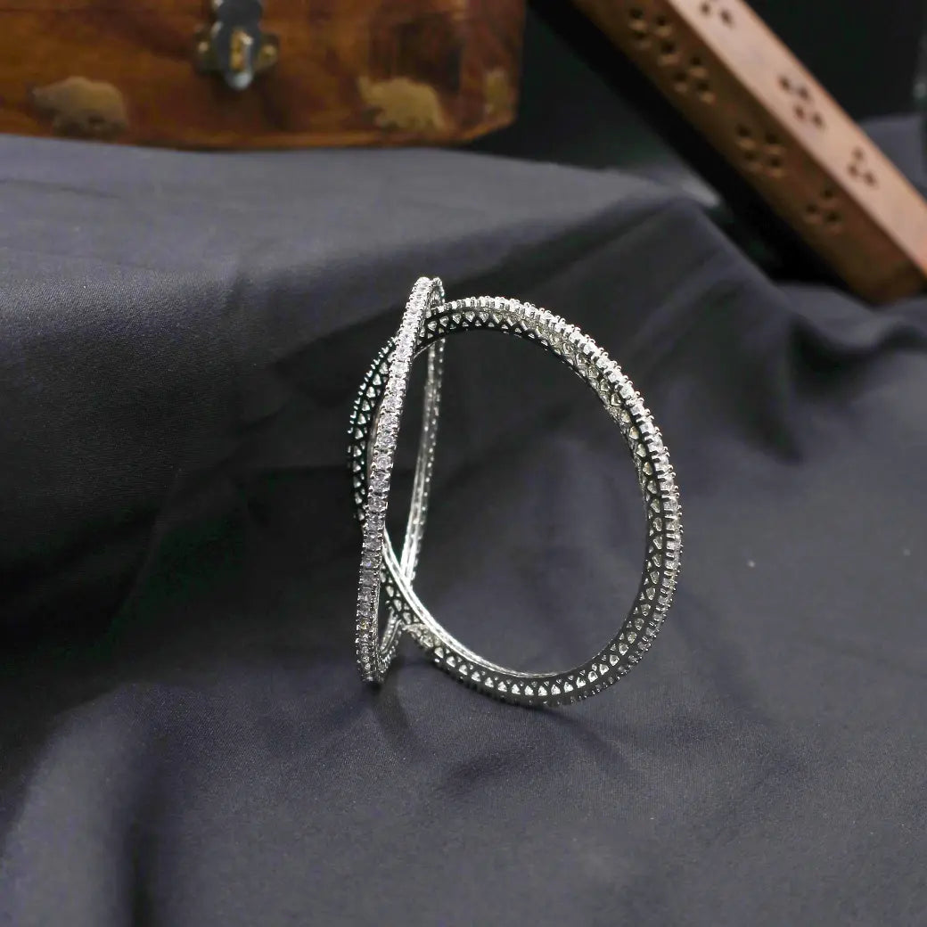 White stone bangles in rhodium like finish