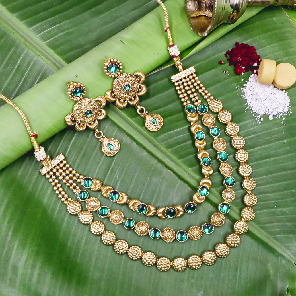 Layered necklace with green Kundan stones with matching earrings