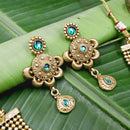 Layered necklace with green Kundan stones with matching earrings