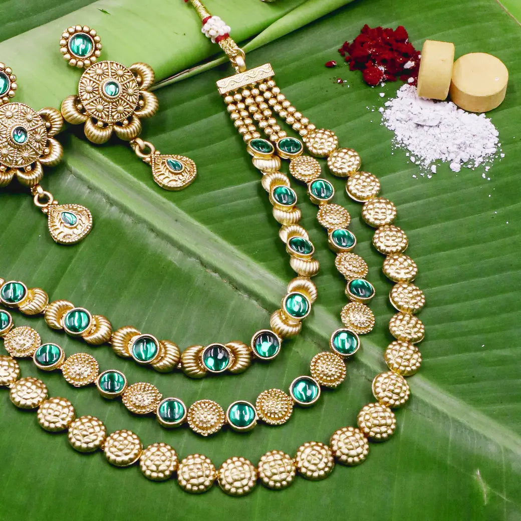 Layered necklace with green Kundan stones with matching earrings