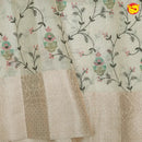 Cream linen tissue saree with embroidery details - Thenianantham