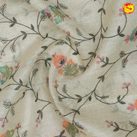 Cream linen tissue saree with embroidery details - Thenianantham