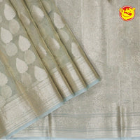 White Semi - Tissue Saree With Unique Buttas, Traditional Zari Border & Pallu Of Intricate Designs - Thenianantham