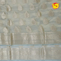 White Semi - Tissue Saree With Unique Buttas, Traditional Zari Border & Pallu Of Intricate Designs - Thenianantham