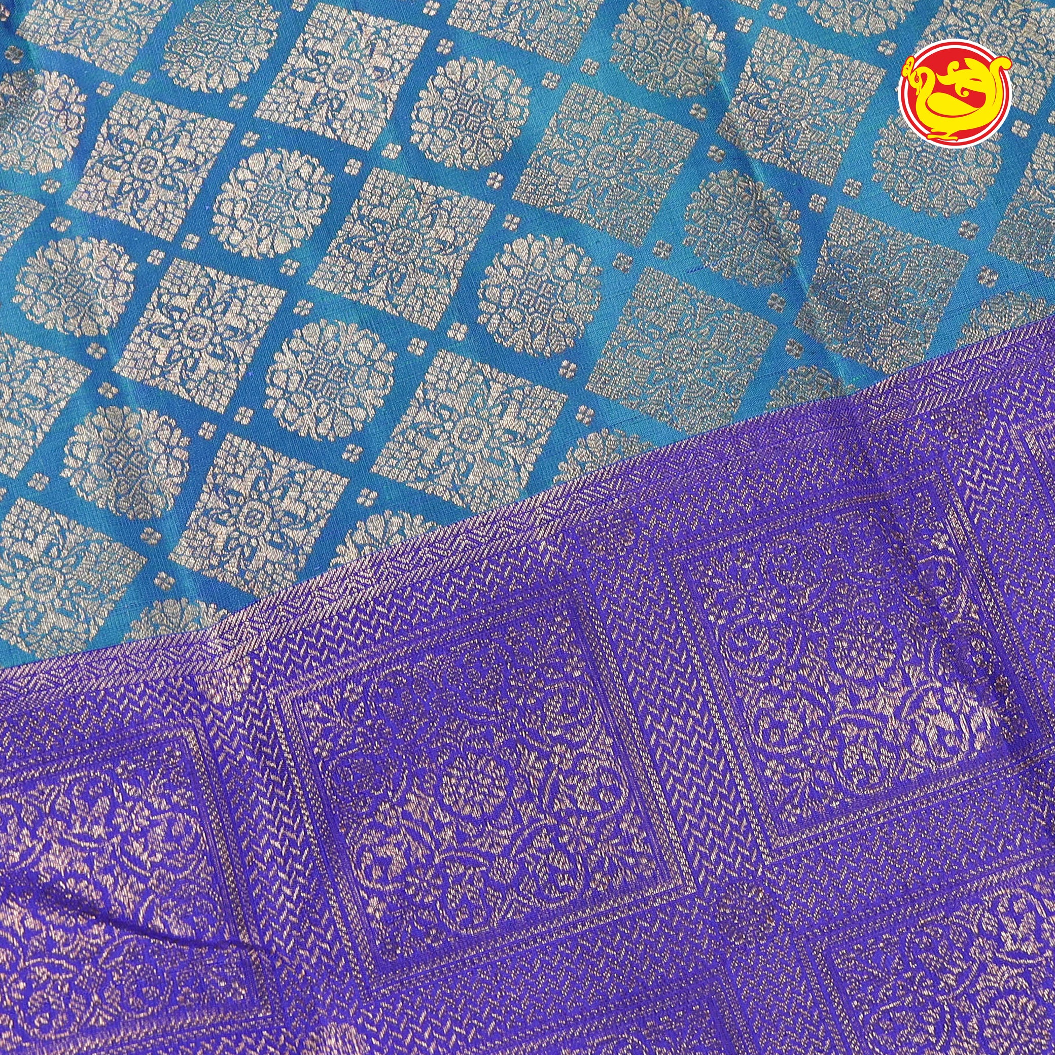 Peacock blue pure Kanchivaram silk saree in half and half pattern