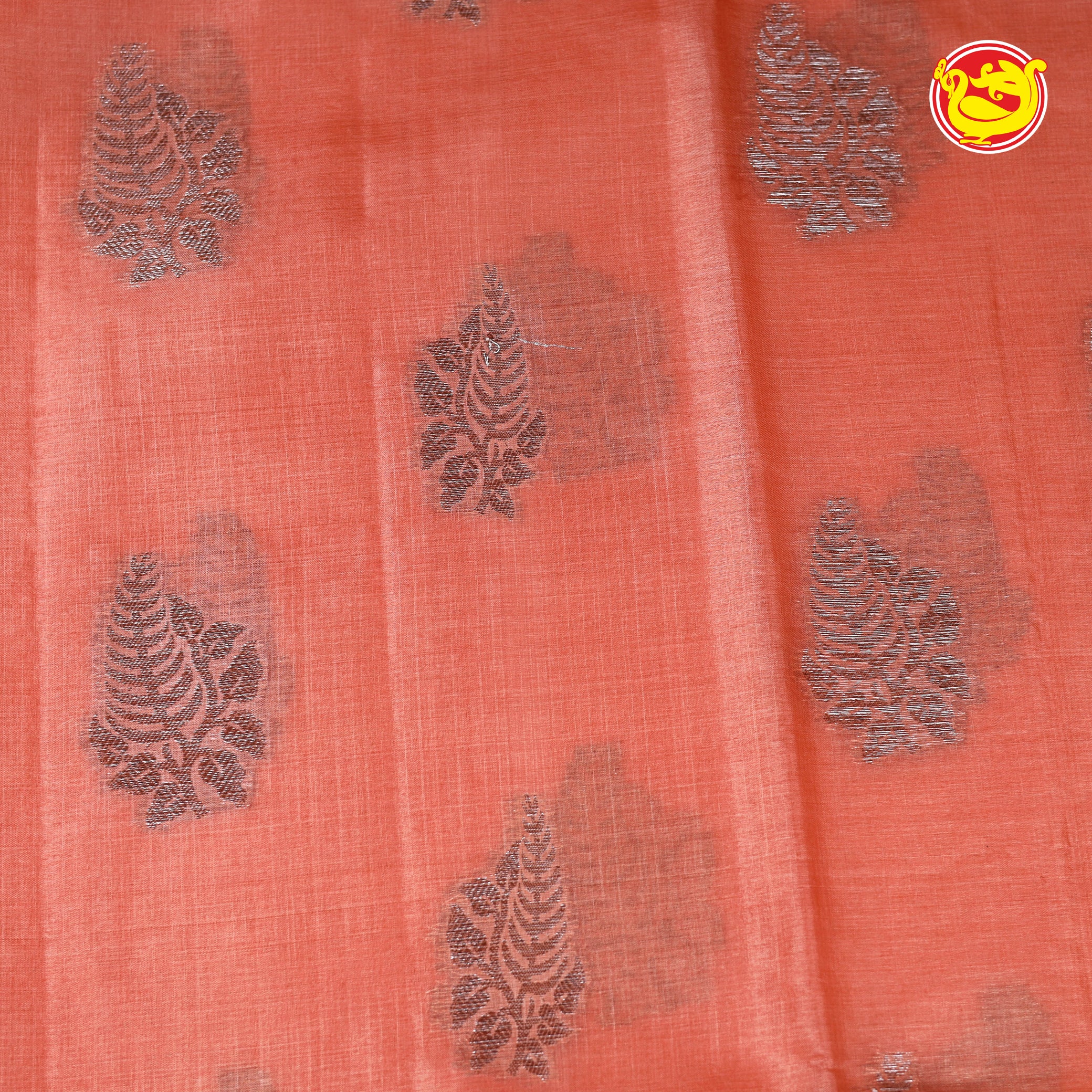 Peach tussar silk saree with silver zari buttas